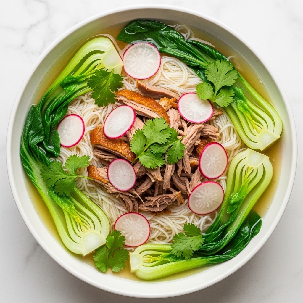 A white bowl filled with broth containing a base layer of thin white noodles, topped with pieces of cooked brown shredded meat at the center. Around the meat, there are green bok choy leaves partially submerged in the light yellow broth. Thin slices of red-edged white radishes are scattered on top and around the meat and vegetables. Fresh green cilantro leaves are sprinkled over the entire dish. The bowl sits on a white marbled surface. Photo taken with an iphone --ar 4:5 --v 7