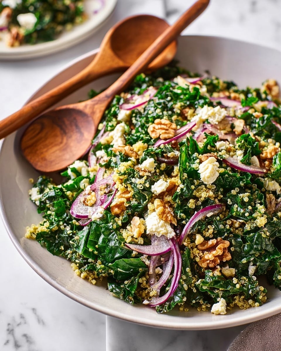 A white shallow round dish holds a fresh green salad with chopped leafy greens as the base layer, mixed with small light beige quinoa grains. Thin curved slices of bright purple-red onions are scattered throughout the salad. Small chunks of off-white cheese are spread across the top along with uneven pieces of brown walnuts, adding texture. Two wooden salad spoons rest on the right edge of the dish, placed on a white marbled surface. photo taken with an iphone --ar 4:5 --v 7